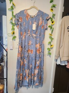 Keluummi light blue and orange floral maxi dress featuring a smocked bodice, ruf